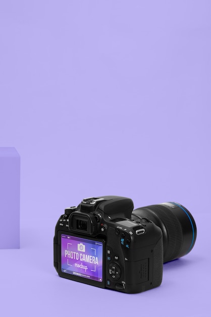 PSD photo camera with purple background mockup