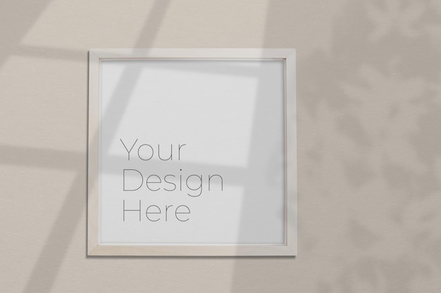 Mockup di cornice per foto su grigio con sovrapposizione di ombre