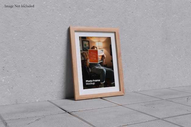 Photo in frame with tile ceramic floor and concrete wall background texture mockup template