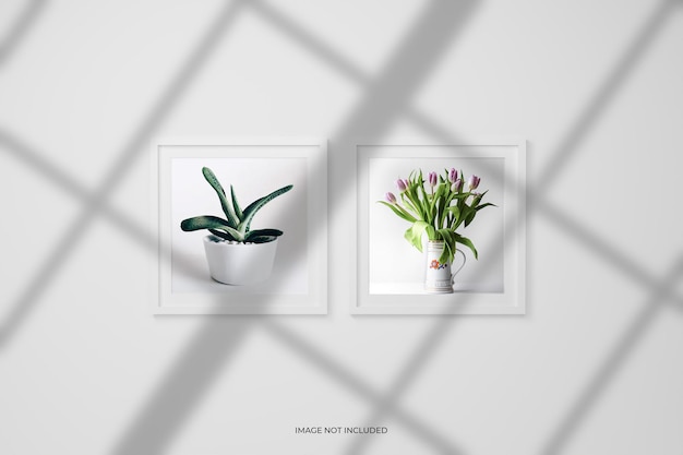 PSD photo frames or poster mockup on the wall