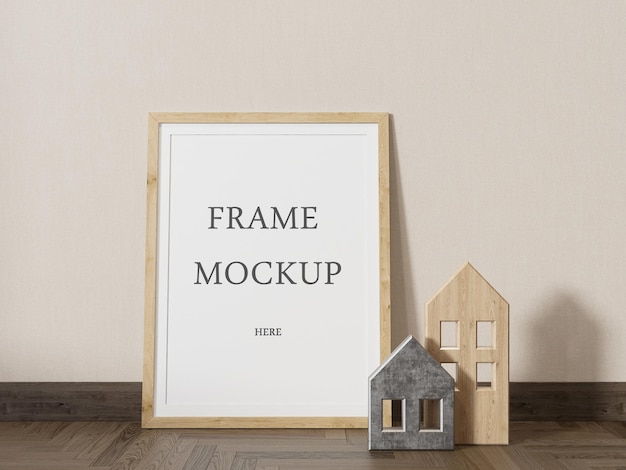 PSD picture frame mockup placed on the floor next to small house figures