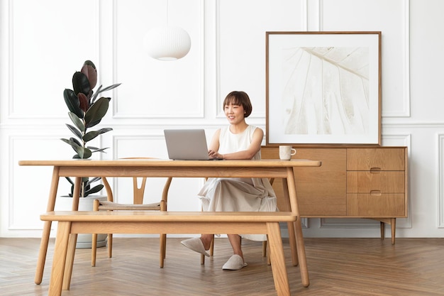 Picture frame mockup psd with woman working from home