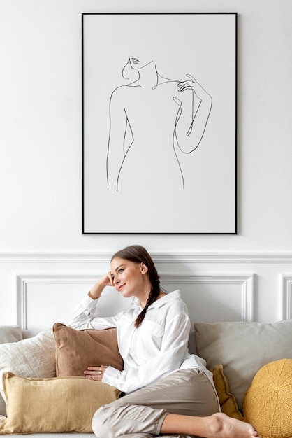 PSD picture frame mockup  with woman relaxing at home