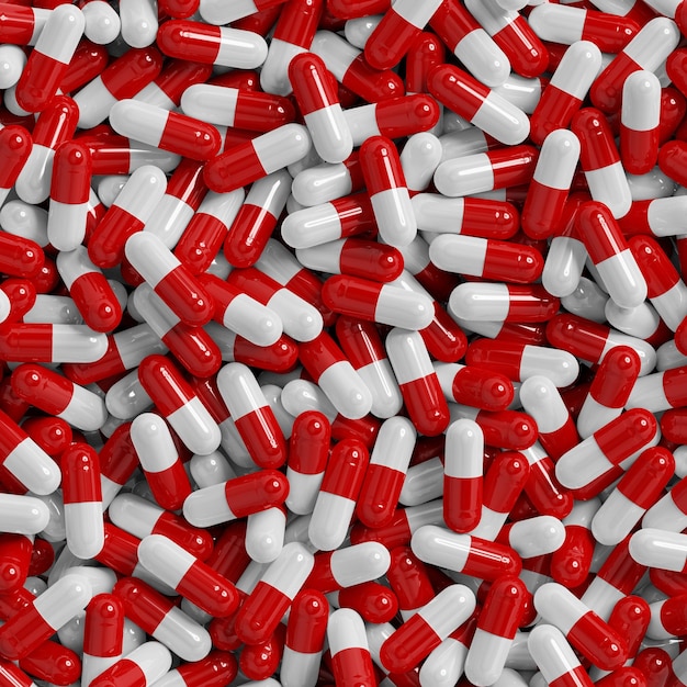 Un mucchio di pillole rosse e bianche che sono tutte raggruppate insieme farmaci da prescrizione capsule mockup