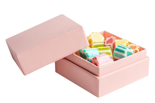 pink box with sweets and lollipops on an empty background