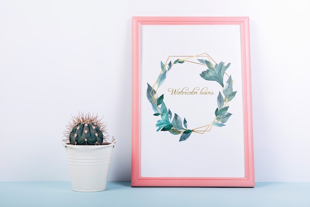 PSD pink frame mockup with decorative cactus