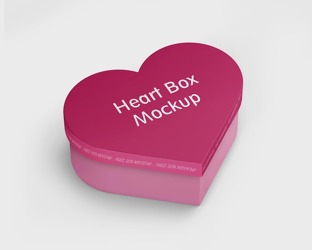 Un mockup di scatola del cuore rosa con le parole mockup della scatola del cuore.