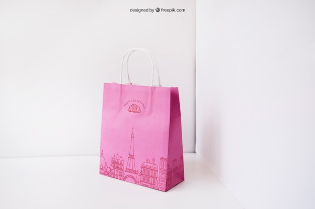 Pink paper bag in corner