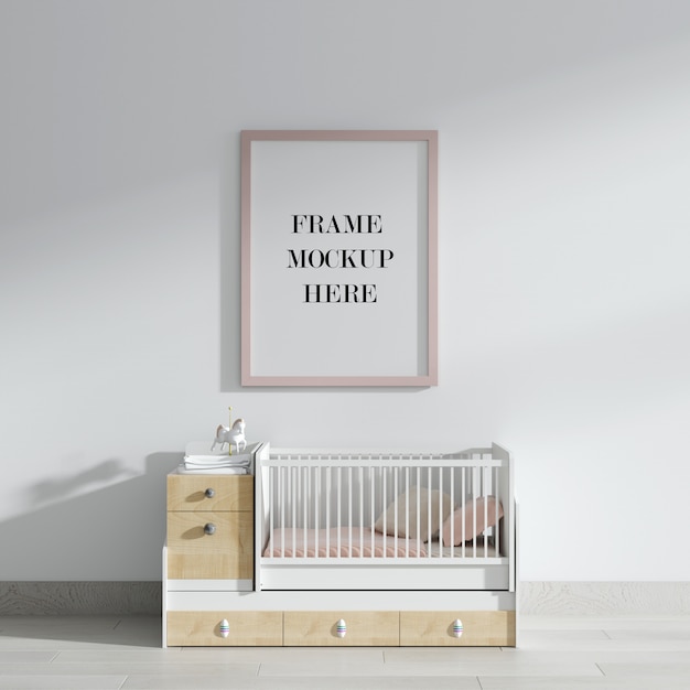 Pink wall frame mockup above baby bed