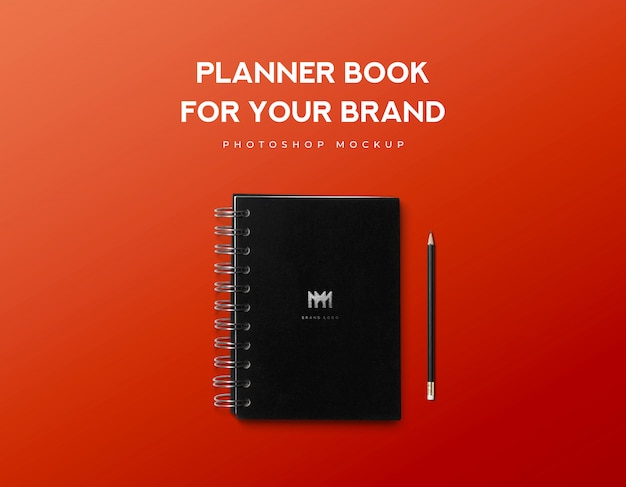 PSD planner book for your brand and black pencil on red background