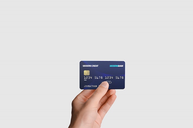 Plastic card in hand mockup