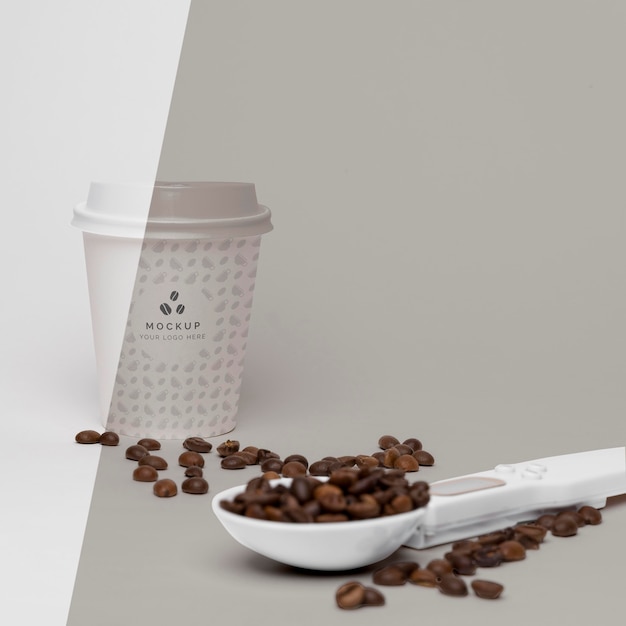 Plastic cup with coffee beans