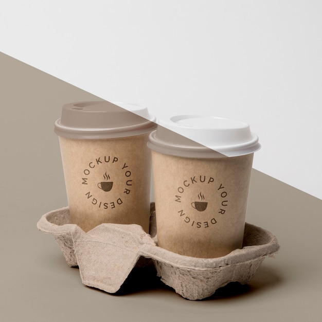 PSD plastic cup with coffee mock up in support