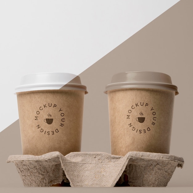 PSD plastic cup with coffee mock up in support