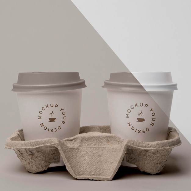 PSD plastic cup with coffee mock up in support