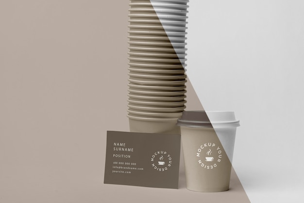 PSD plastic cups with coffee mock up on table