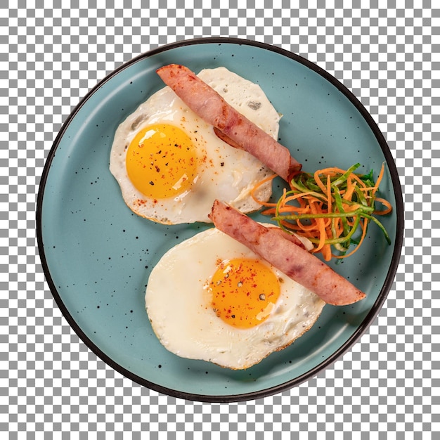 PSD a plate of fried eggs with sausages and carrots on transparent background