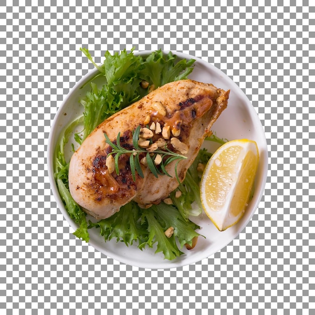 A plate of grilled chicken breast with a lemon slice on transparent background