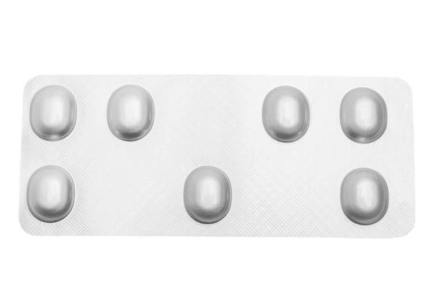 plate of pills on empty background