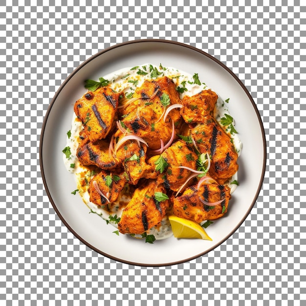 PSD plate of roasted chicken pieces with lemon and onions on transparent background