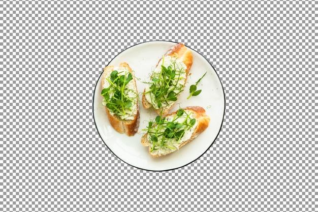 PSD a plate of toast with cheese arugula and parsley on isolated and transparent background