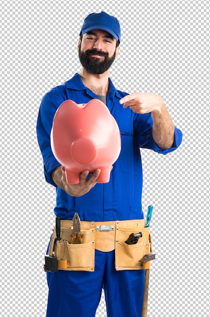 Plumber holding a piggybank