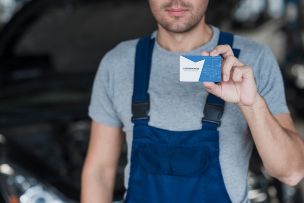 Plumber presenting business card