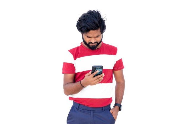 Png of a man in a red and white shirt looking at his cell phone in no background with beard