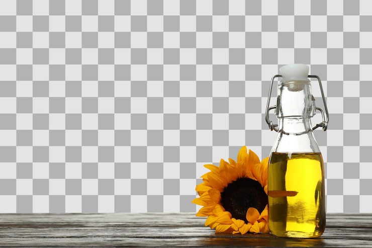 PSD png oil in glass bottle and sunflower on wooden table isolated on white background space for text