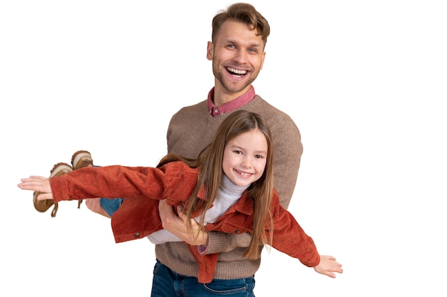 portrait of father playing airplane with daughter for traveling