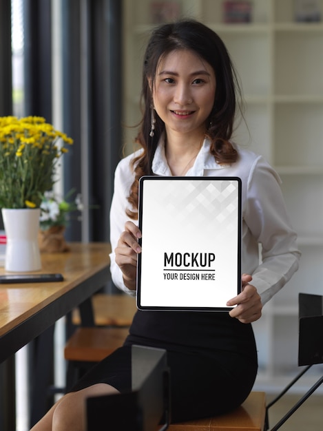 PSD portrait of female student showing tablet mockup