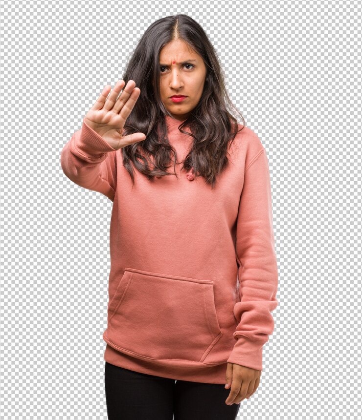PSD portrait of fitness young indian woman serious and determined, putting hand in front, stop gesture, deny concept