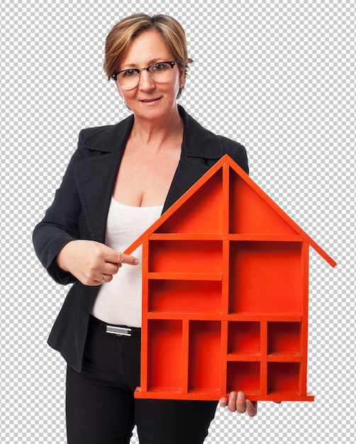 Portrait of a mature businesswoman holding a house shape