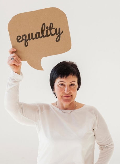 PSD portrait of mature woman holding equality sign