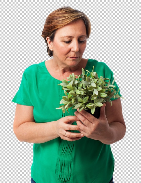 Portrait of a mature woman taking care of a plant