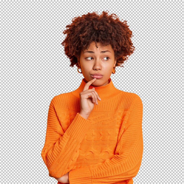 PSD portrait of unhappy thoughtful melancholy young woman feels upset looks aside with displeased expression thinks how to solve problem isolated over orange wall