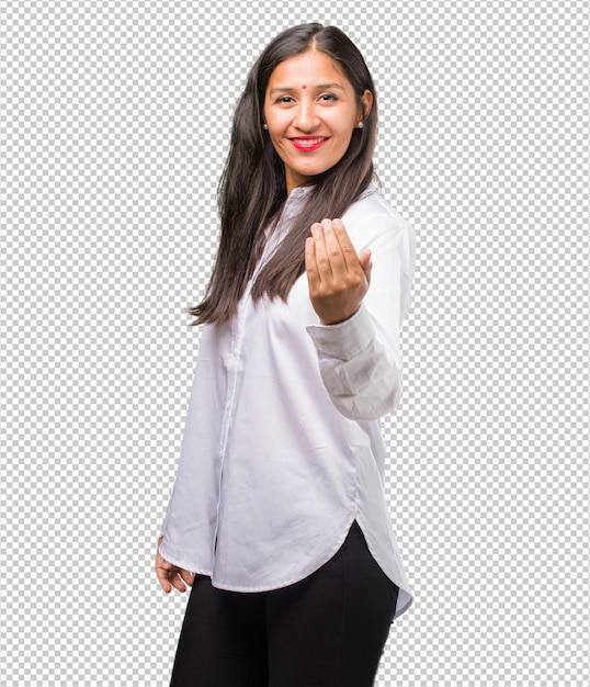 Portrait of a young indian woman inviting to come, confident and smiling making a gesture