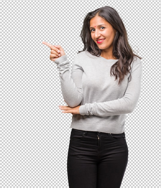 portrait of young indian woman pointing to the side