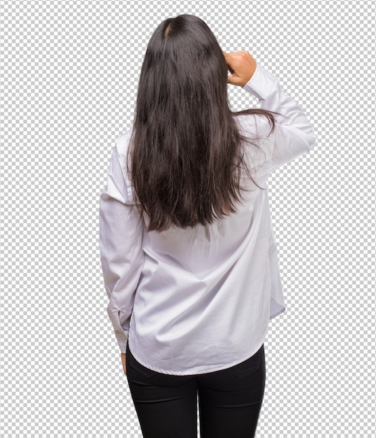 PSD portrait of a young indian woman showing back, posing and waiting, looking back