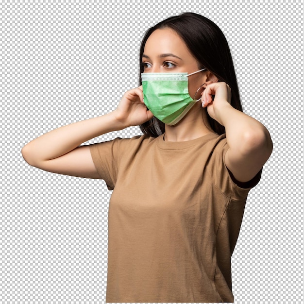 Portrait of a young woman in a medical mask isolated on grey