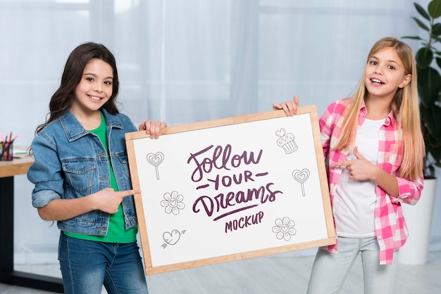 Positive children holding mock-up sign