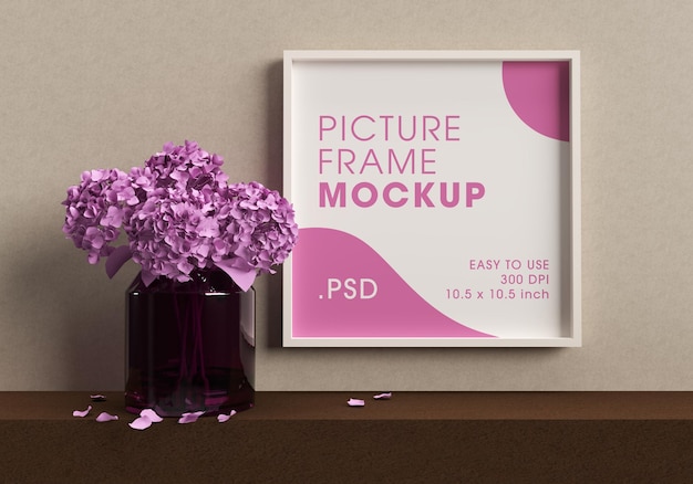 花のモックアップデザインレンダリングと花瓶の横にあるポスターフレーム