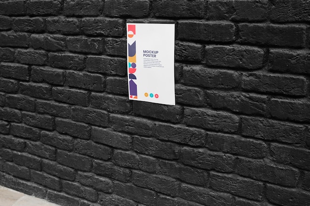 PSD poster mockup glued on wall