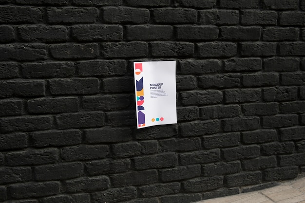 PSD mockup di poster incollato sul muro