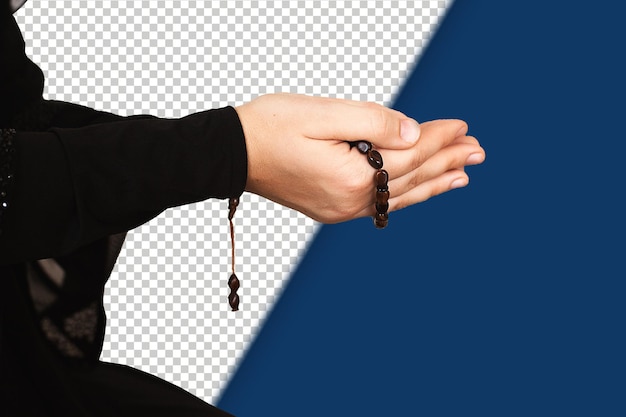 prayer hands of a woman holding a rosary