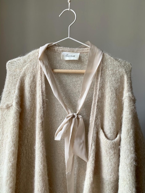 premium clothing label logo mockup on a cardigan for brand presentation