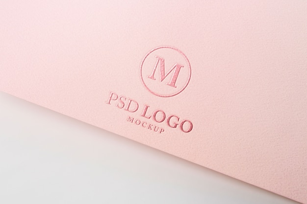 PSD pressed logo mock-up on paper corner close-up