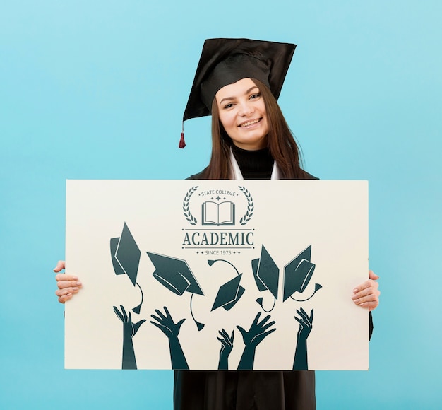 Proud university student holding mock-up sign