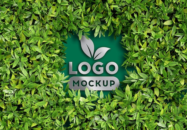 PSD 3d logo mockup in green leaves wall