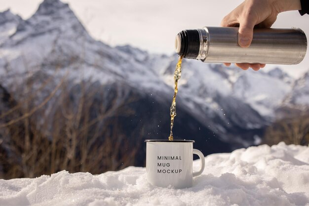 PSD psd flask pouring tea into cup mockup